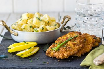 Combination Of Pork Schnitzel With The Tasty Potato And Mayonnaise Salad