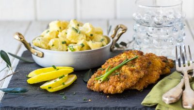 Combination Of Pork Schnitzel With The Tasty Potato And Mayonnaise Salad